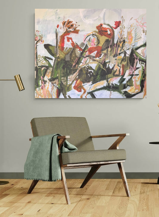 White, coral and green abstract painting on a pale sage wall above a sage green chair with a green blanket and oak wood floor.