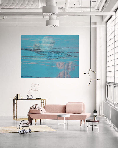 blooming algae depicted as blue and pink abstract oil painting on canvas created by artist danielle nelisse and installed on white all in modern living room with pink couch next to large window