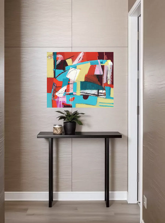Bold red, white, aqua and yellow original abstract painting on canvas created by artist danielle nelisse installed on cream colored wall in luxury neutral designed hall above dark brown modern hall table with plant on it