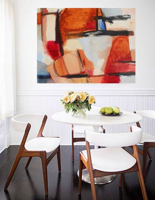large rust, white and light blue abstract painting on dining room wall with white walls and dark brown wood floor and white luxury dining set